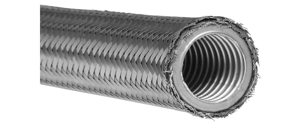 Coupe d’un flexible métallique ondulé sous tresse inox